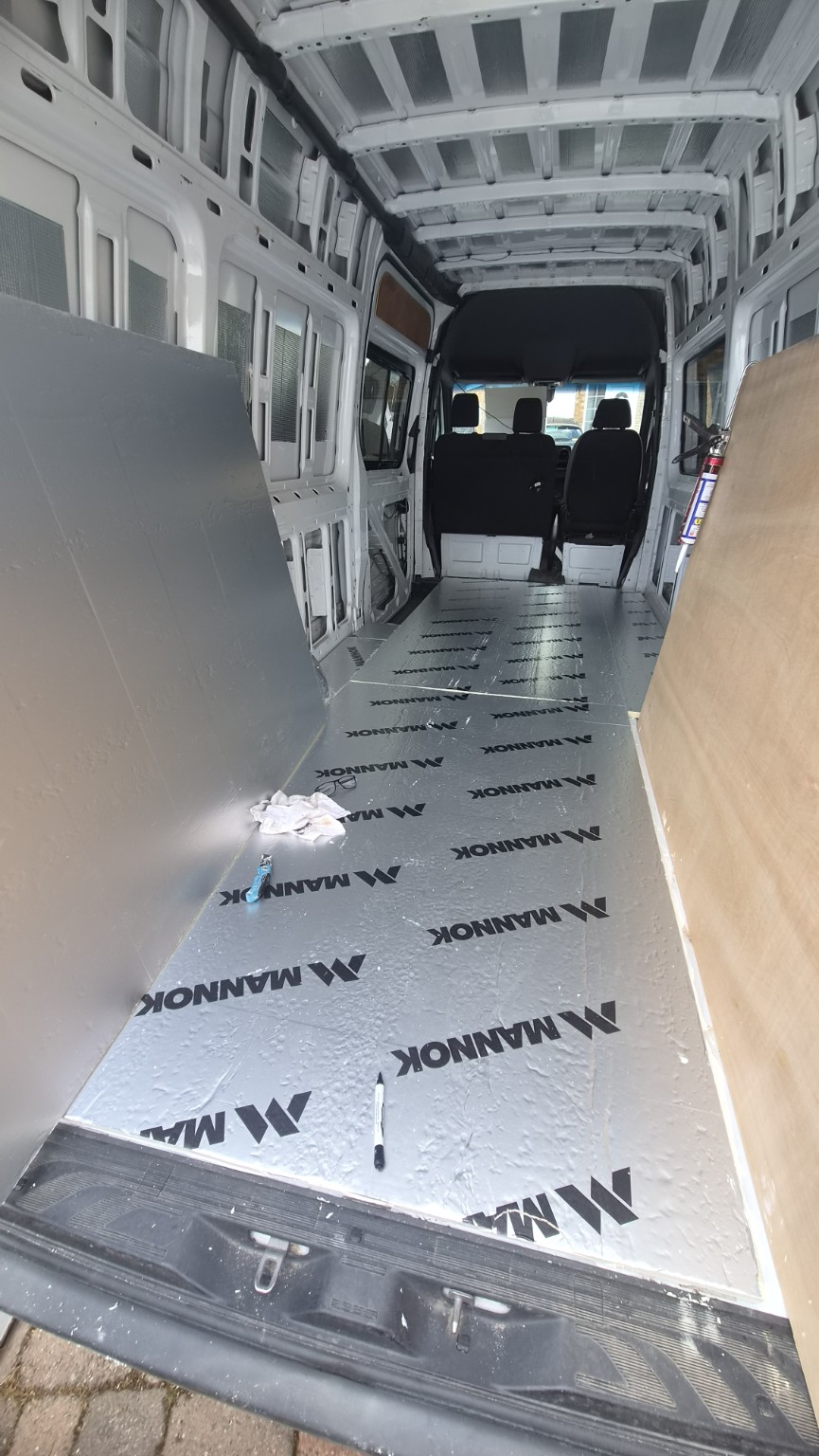 Insulated flooring inside a Mercedes Sprinter during conversion