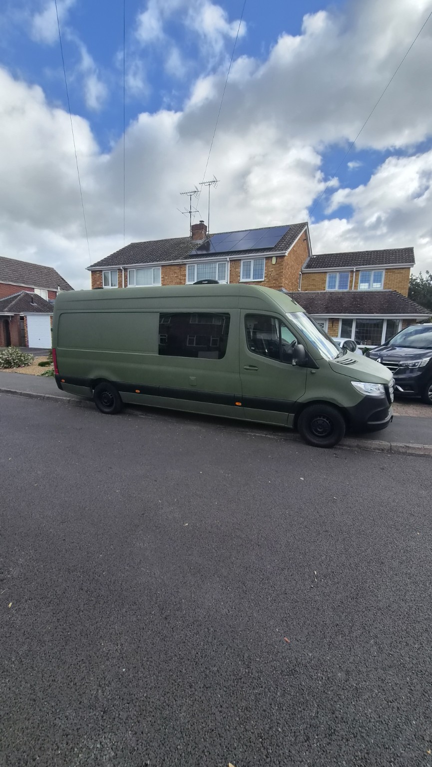 Marge’s olive-green Mercedes Sprinter exterior